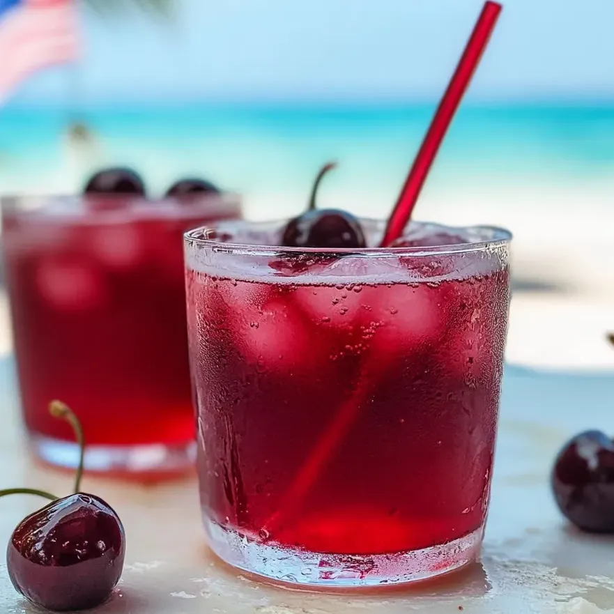 Un vaso de refresco burbujeante de cereza y vainilla.